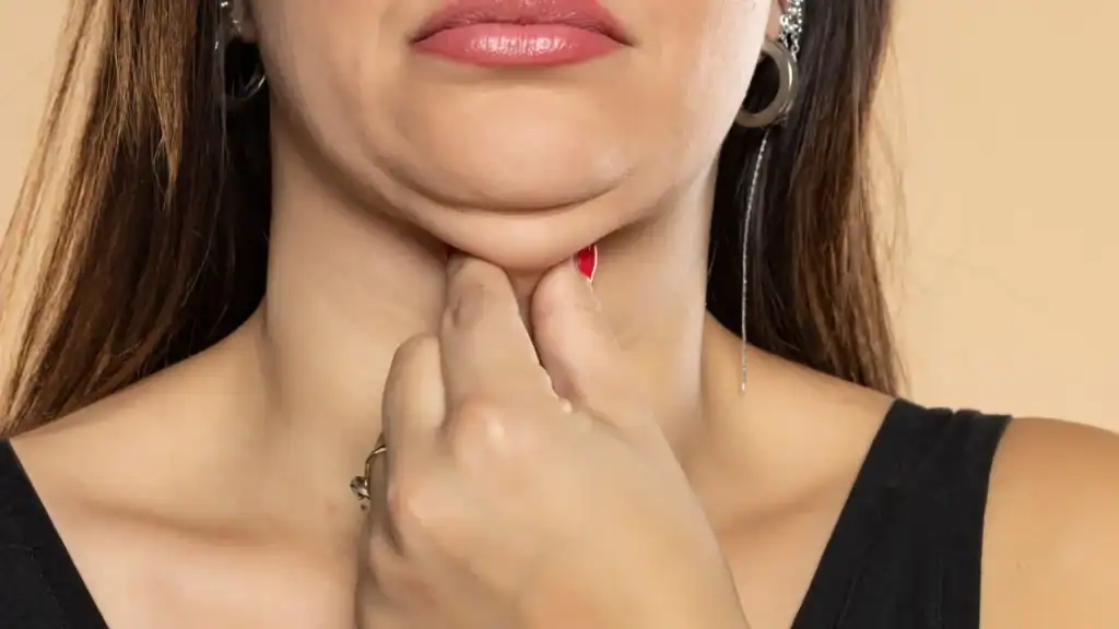 An image of a woman with double chin, sad, worried : Non Surgical Double Chin Removal Treatment in Wincanton, UK