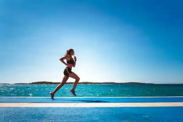 Woman running showing strong leg muscle Wincanton